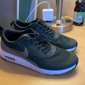 Dark green Nike running shoes